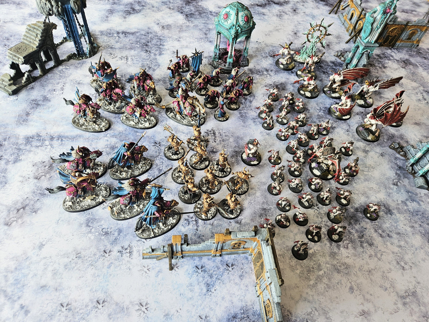 Miniature wargame battle on Ice Tundra mat set in frozen wasteland terrain for tactical tabletop gameplay