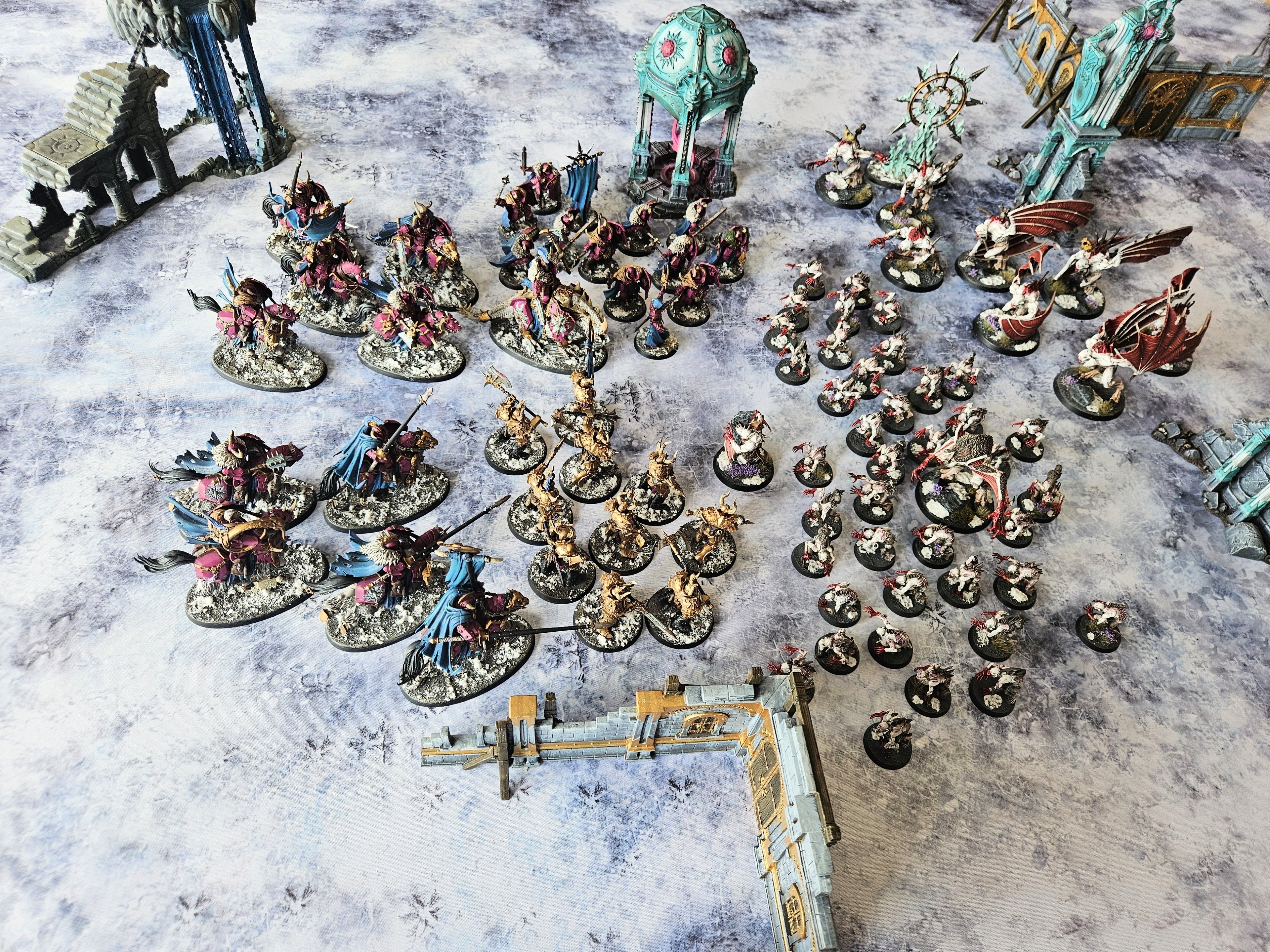 Miniature wargame battle on Ice Tundra mat set in frozen wasteland terrain for tactical tabletop gameplay